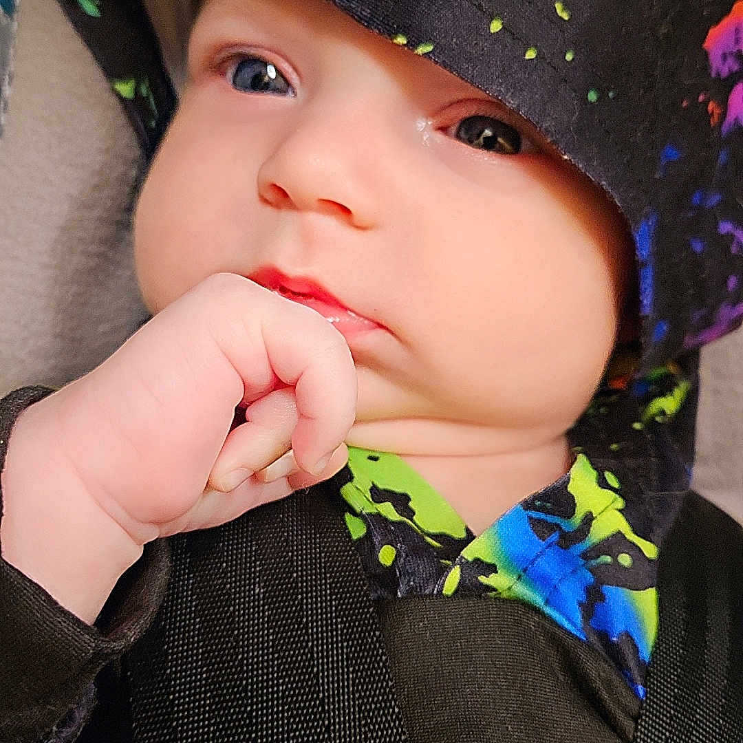 Dominic is registered to the contest to win money with this photo: baby, beanie, bodypart, bonnet, cap, clothing, cosmetics, face, finger, hand, hat, head, hood, hoodie, knitwear, lipstick, person, sunhat, sweater, sweatshirt