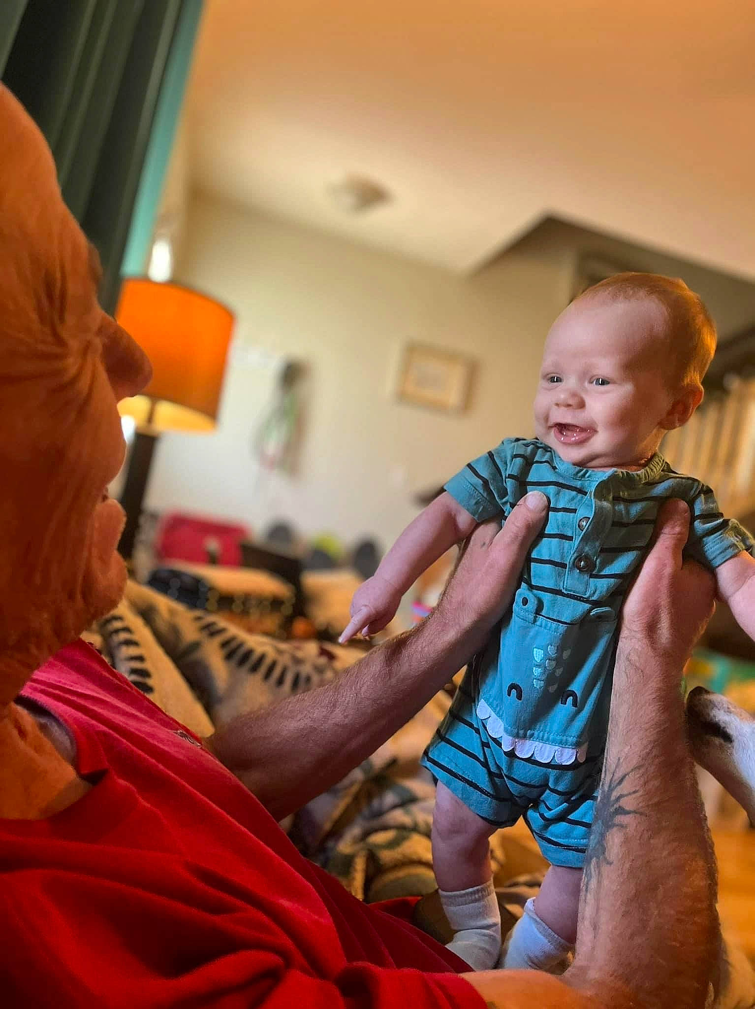 Juelz is registered to the contest to win money with this photo: baby, child, comfort, conversation, event, fashion_design, fun, hand, happy, interaction, leisure, magenta, nail, orange, pattern, person, room, sitting, skin, toddler