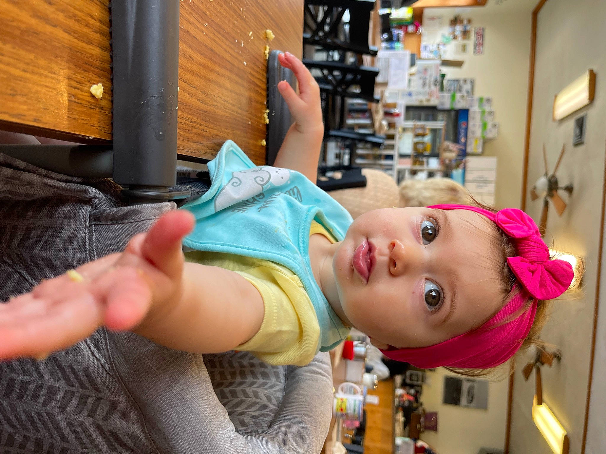 Hayden is registered to the contest to win money with this photo: arm, baby, baby_toddler_clothing, cheek, child, elbow, eyelash, fun, gesture, happy, headwear, human_leg, leisure, mouth, person, room, t_shirt, thumb, toddler, vacation