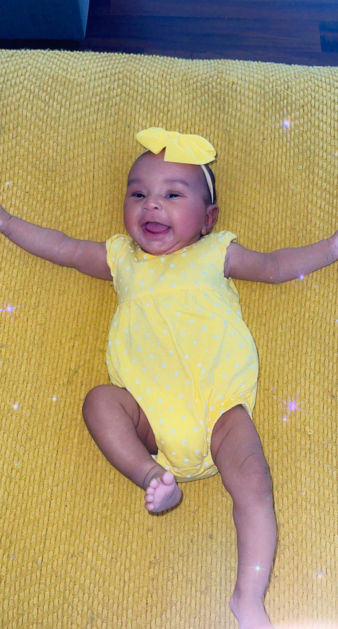 Aaliyah joined the competition — help win amazing prizes! baby, baby_toddler_clothing, barefoot, cheek, child, eye, finger, flooring, foot, fun, happy, headwear, human_leg, iris, knee, leg, pattern, person, sleeve, thigh