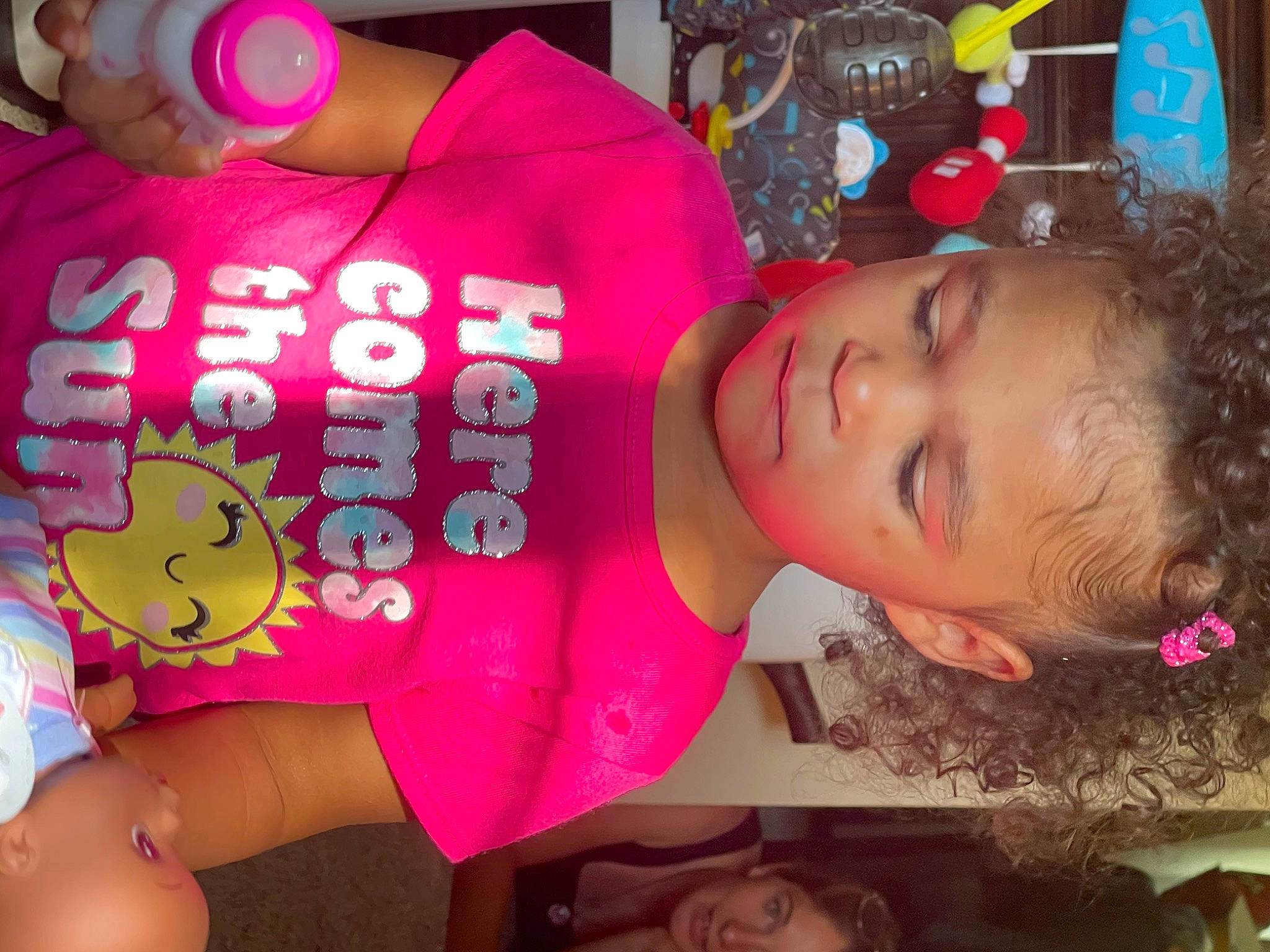 Kinsley is registered to the contest to win money with this photo: black_hair, cheek, child, cool, fun, happy, magenta, mouth, nail, party, party_supply, person, pink, plush, skin, stuffed_toy, sweetness, textile, thigh, toddler