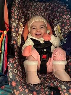 Anastasia is registered to the contest to win money with this photo: baby, baby_carriage, baby_products, baby_toddler_clothing, car_seat, carmine, cheek, child, comfort, fun, happy, headwear, joy, lap, laugh, pattern, person, sitting, smile, sock