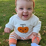 Adrian joined the competition — help win amazing prizes! autumn, baby, child, cute, daylight, fall, grass, happy, hat, infant, nature, orange, outdoor, playful, portrait, pumpkin, seasonal_clothing, sitting, smiling, socks