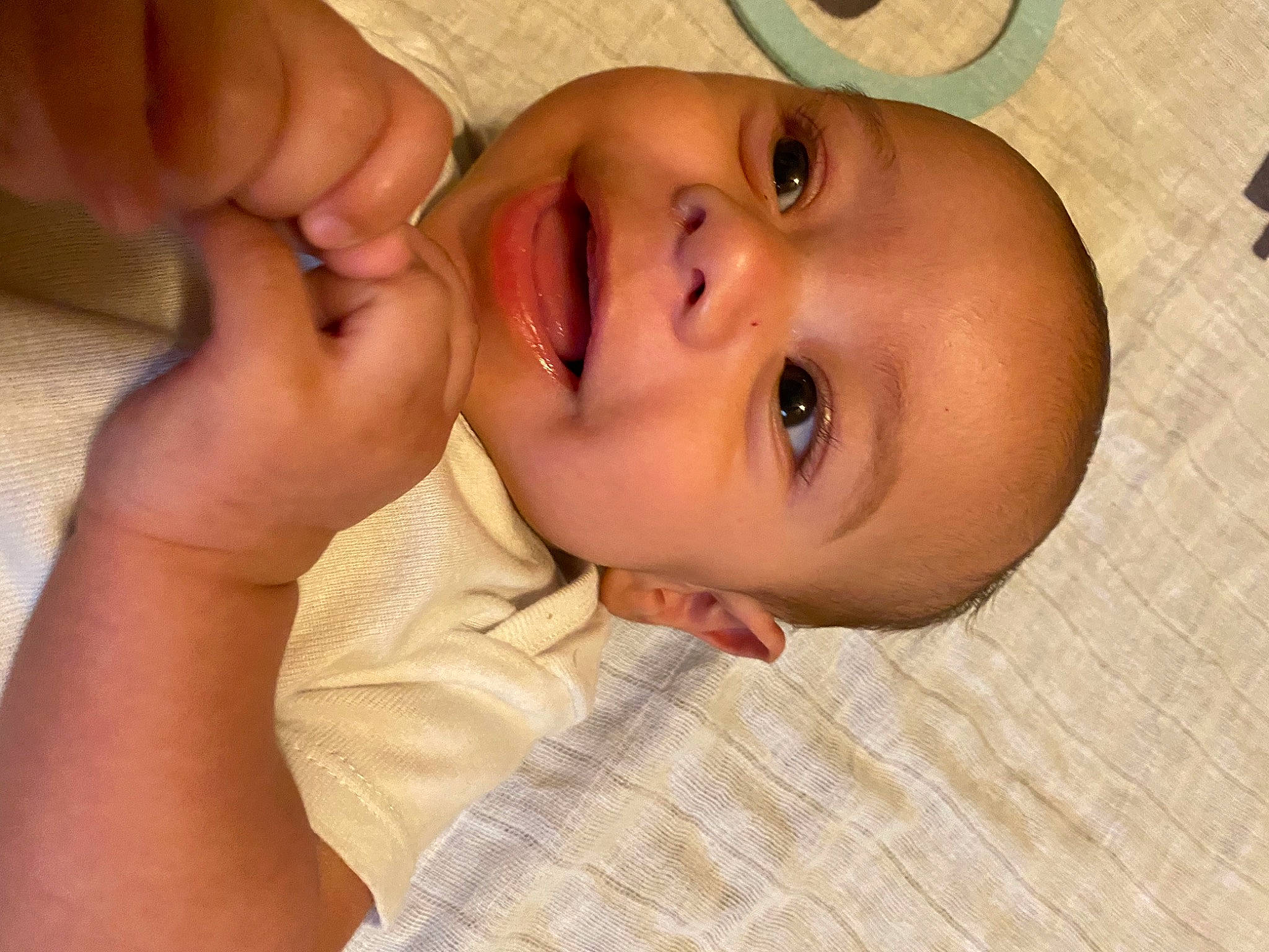 Luka is registered to the contest to win money with this photo: baby, cheek, ear, eye, eyebrow, eyelash, face, finger, gesture, happy, head, human_body, iris, lip, mouth, nose, person, skin, smile, thumb