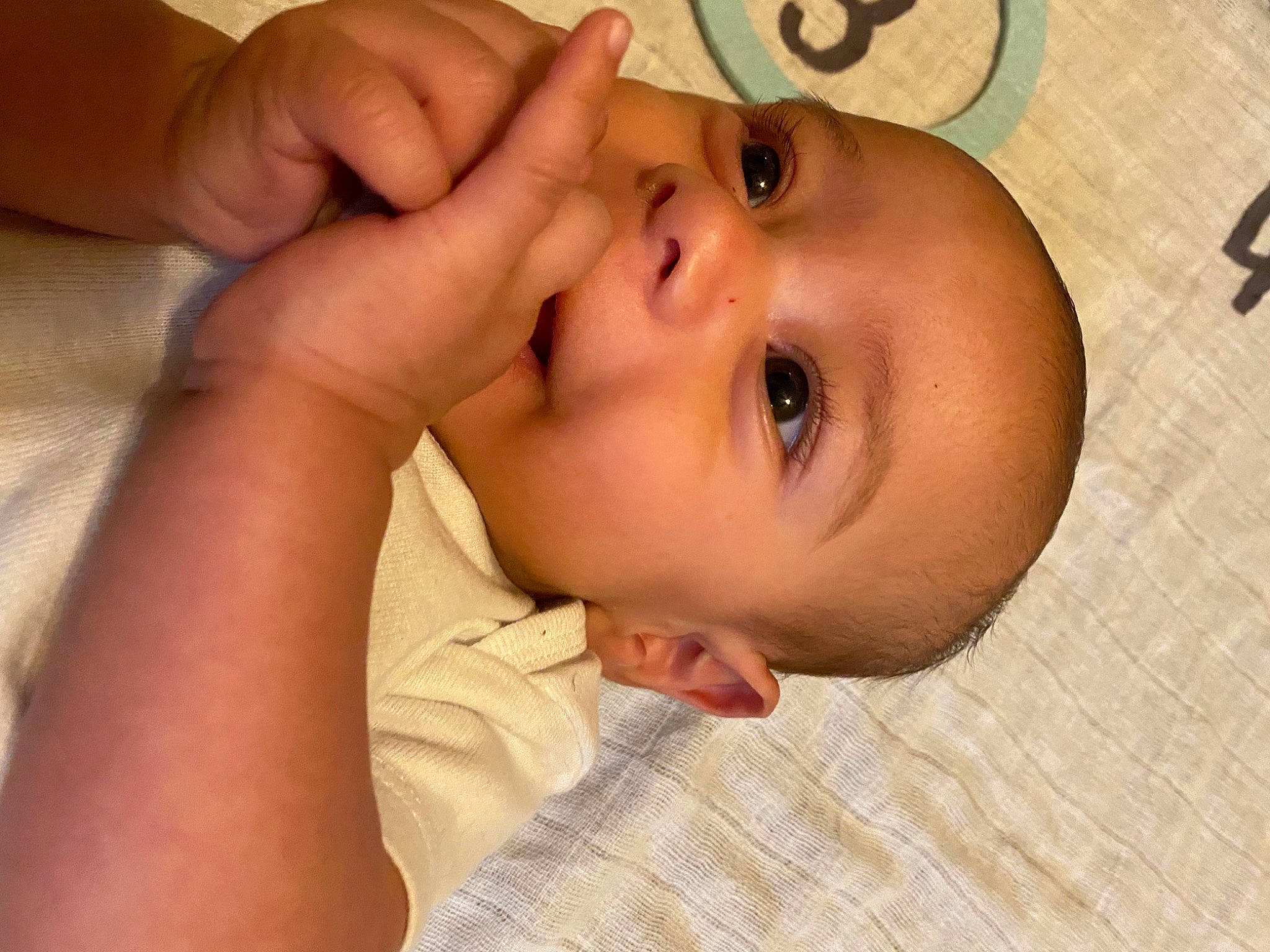 Luka is registered to the contest to win money with this photo: baby, baby_toddler_clothing, cheek, child, chin, ear, eyelash, finger, flooring, gesture, happy, human_body, iris, lip, mouth, nose, person, skin, smile, toddler