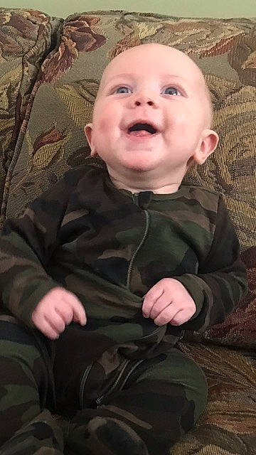 Donald joined the competition — help win amazing prizes! baby, baby_toddler_clothing, brown, cheek, chin, comfort, eye, eyebrow, facial_expression, finger, head, iris, mouth, nose, outerwear, person, skin, sleeve, smile, textile