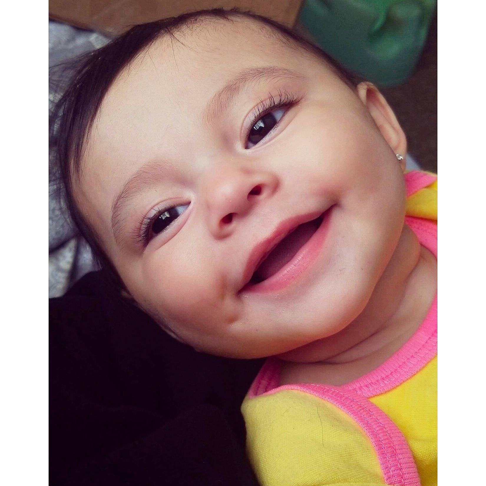 Valencia is registered to the contest to win money with this photo: baby, beauty, cheek, child, chin, close_up, eye, eyebrow, face, facial_expression, forehead, hair, head, lip, mouth, nose, person, pink, skin, smile