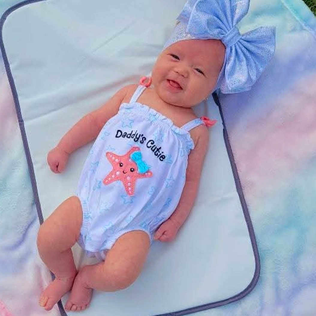 Kerenza is registered to the contest to win money with this photo: baby, backyard, bed, blanket, clothing, face, furniture, grass, hat, head, nature, newborn, outdoors, person, photography, plant, portrait, quilt, sleeping, yard