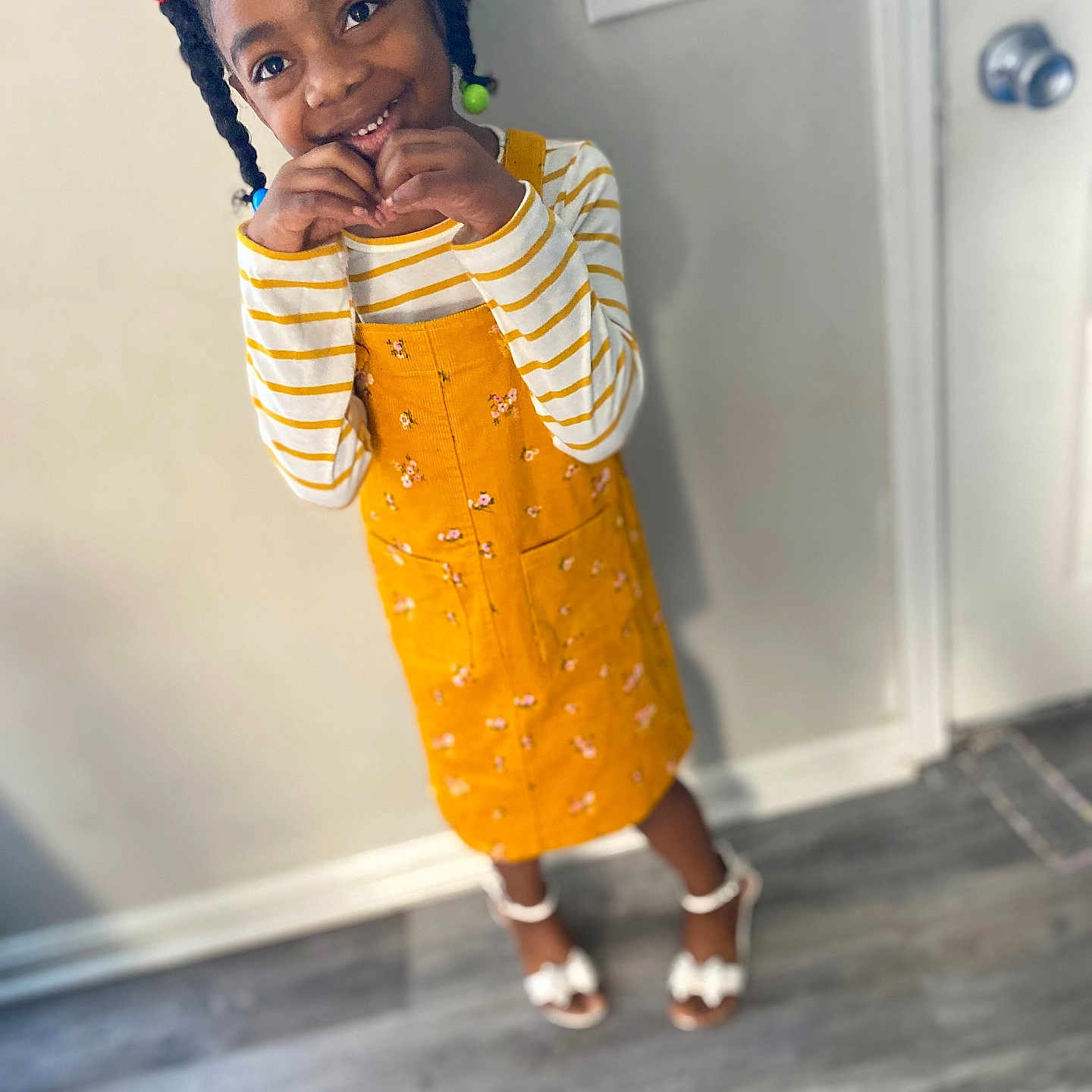 Joasa is registered to the contest to win money with this photo: blackhair, child, clothing, curlyhair, dress, face, female, footwear, girl, hair, happy, head, person, photography, portrait, sandal, sitting, sleeve, smile, standing