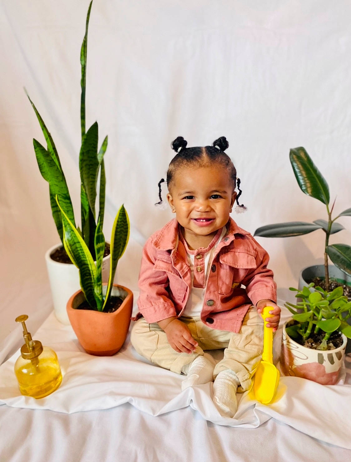 Sincere joined the competition — help win amazing prizes! baby, child, event, facial_expression, fashion_accessory, floral_design, flowerpot, grass, happy, headpiece, houseplant, jewellery, joy, linens, person, plant, portrait_photography, room, sitting, sleeve