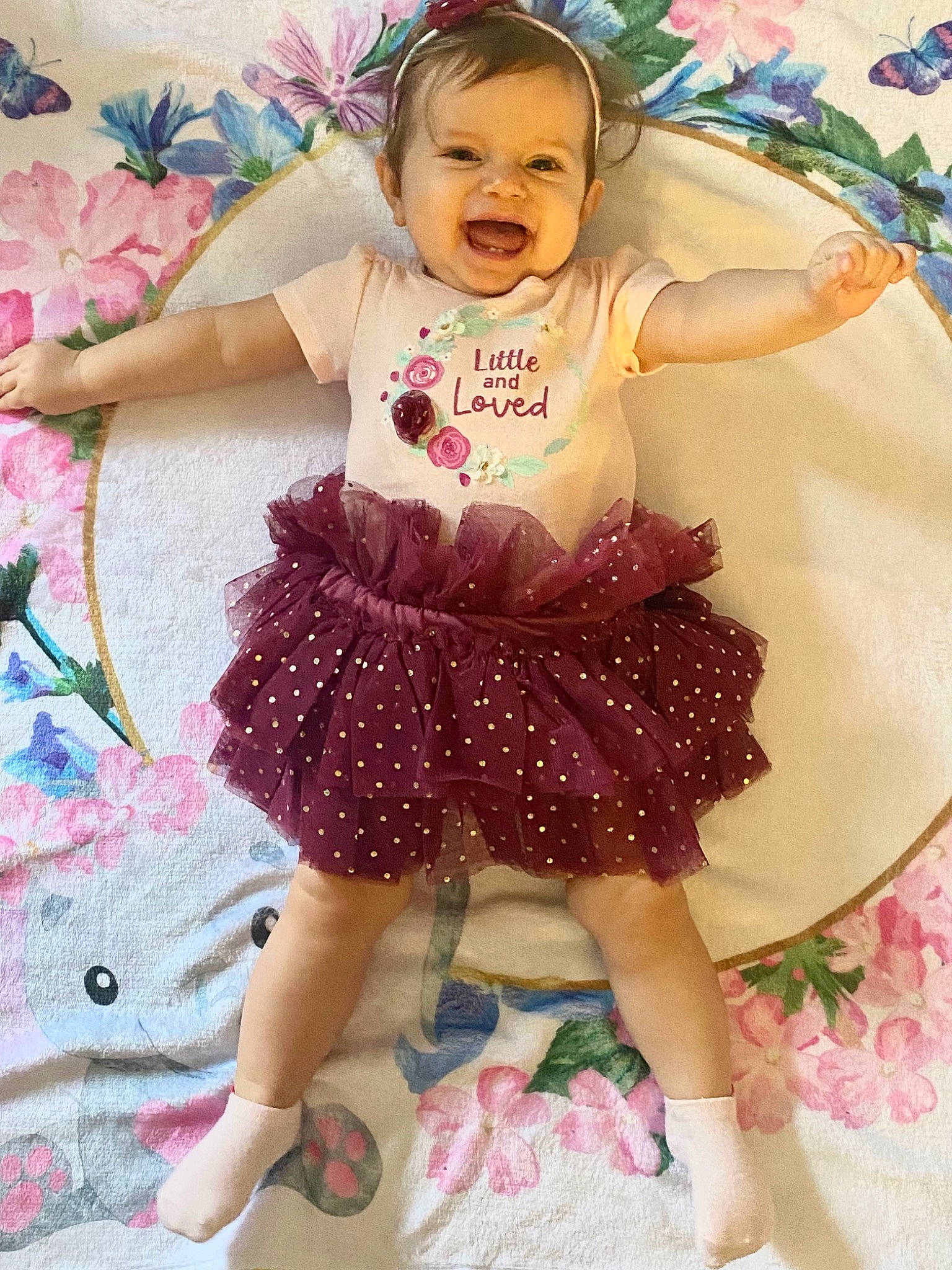 Presley is registered to the contest to win money with this photo: baby_toddler_clothing, blue, child, day_dress, dress, embellishment, face, green, happy, headgear, magenta, one_piece_garment, person, pink, purple, skin, sleeve, smile, textile, violet