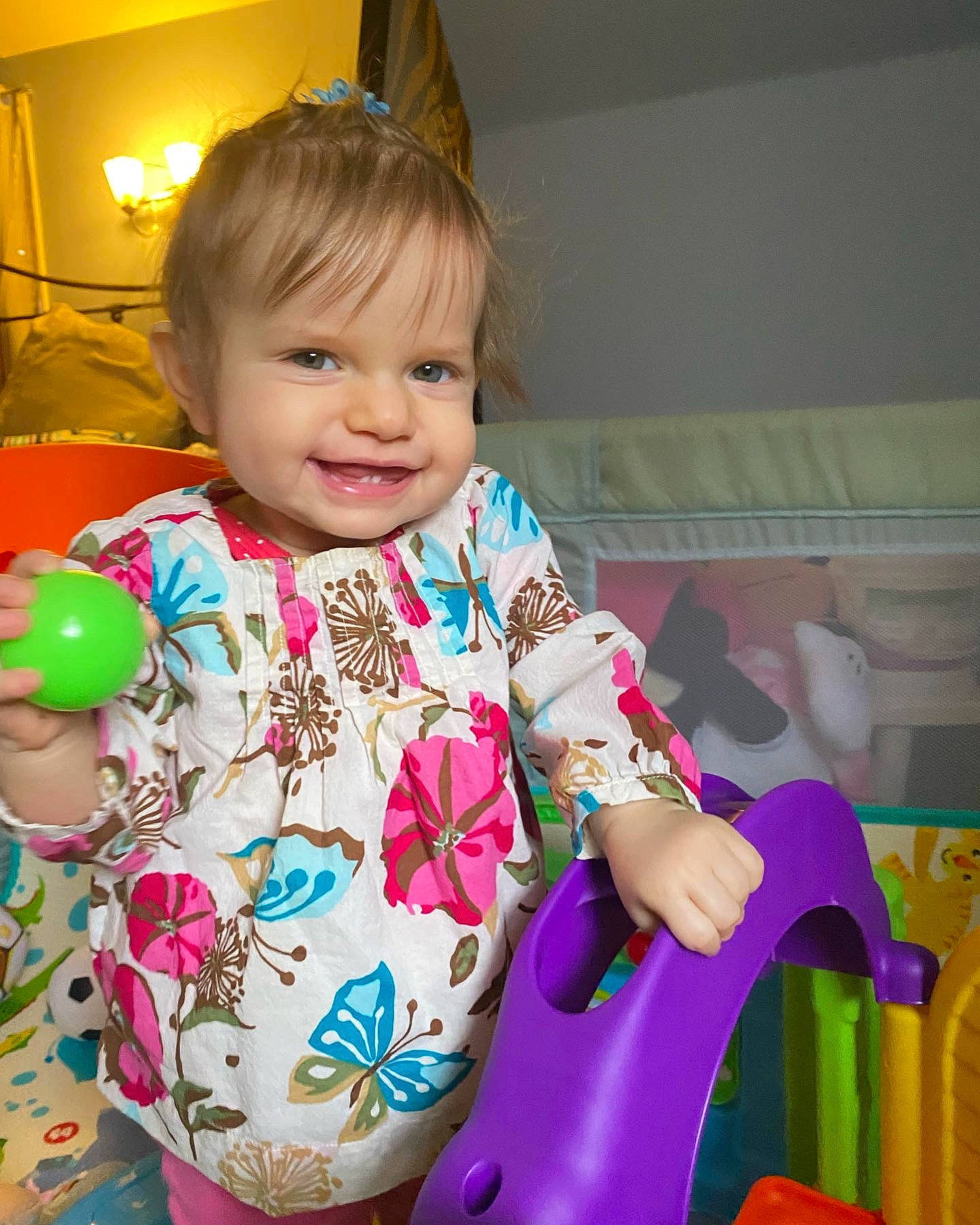 Presley is registered to the contest to win money with this photo: baby, baby_products, baby_toddler_clothing, cheek, child, eye, facial_expression, fun, hair, happy, head, human_body, iris, joy, person, pink, purple, skin, sleeve, smile