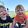 Elino Et Enoha participe au concours pour gagner de l'argent avec cette photo : blue_sky, candid, child, daylight, face, fun, grass, happy, hill, messy_hair, nature, outdoor, person, playful, scenic, short_sleeve_shirt, smiling, sunny, toddler, two_children