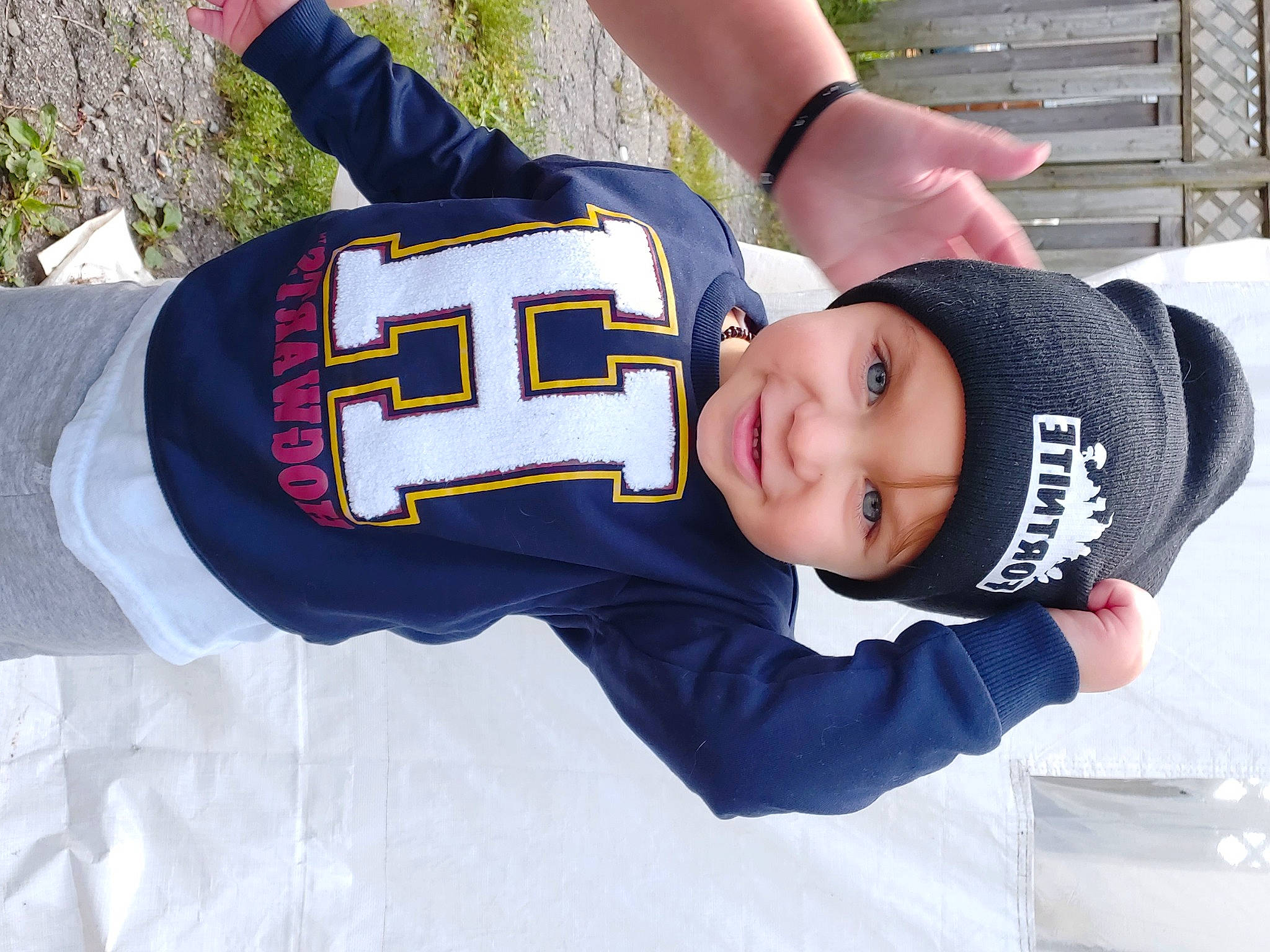 Kreed joined the competition — help win amazing prizes! baby, baby_toddler_clothing, cap, electric_blue, fun, gesture, happy, headgear, headwear, jersey, joy, person, plant, player, sleeve, smile, snow, sports_gear, sports_jersey, sports_uniform