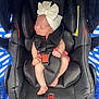 baby, black, blue_background, car_seat, child, comfort, cute, foot, hand, headband, indoors, infant, newborn, peaceful, pink_clothing, resting, safety_harness, seat, sleeping, small