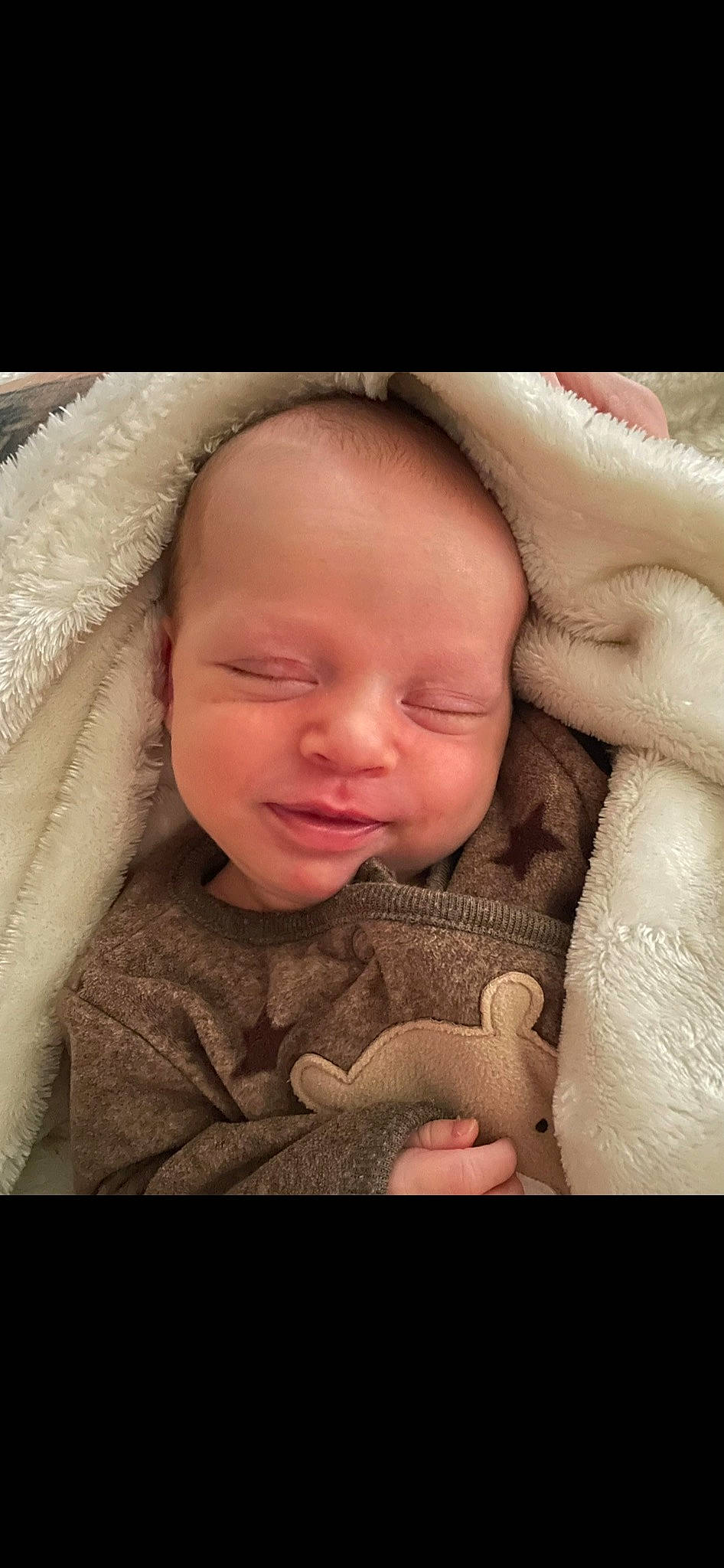 Jason is registered to the contest to win money with this photo: arm, baby, baby_toddler_clothing, cheek, child, comfort, ear, eyebrow, eyelash, flash_photography, gesture, happy, iris, lip, mouth, nose, person, skin, smile, thumb