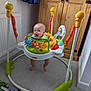 Wyatt is registered to the contest to win money with this photo: baby, carpet, child, colorful, curtain, feet, fisher_price, floor, furniture, happy, indoors, infant, jumper, person, play, radiator, room, smile, toy, wooden_cabinet