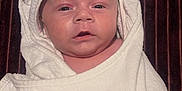 Wyatt is registered to the contest to win money with this photo: baby, towel, face, headwear, infant, wrapped, white, cute, portrait, newborn, expression, soft, skin, child, indoors, blanket, closeup, person, cozy, adorable