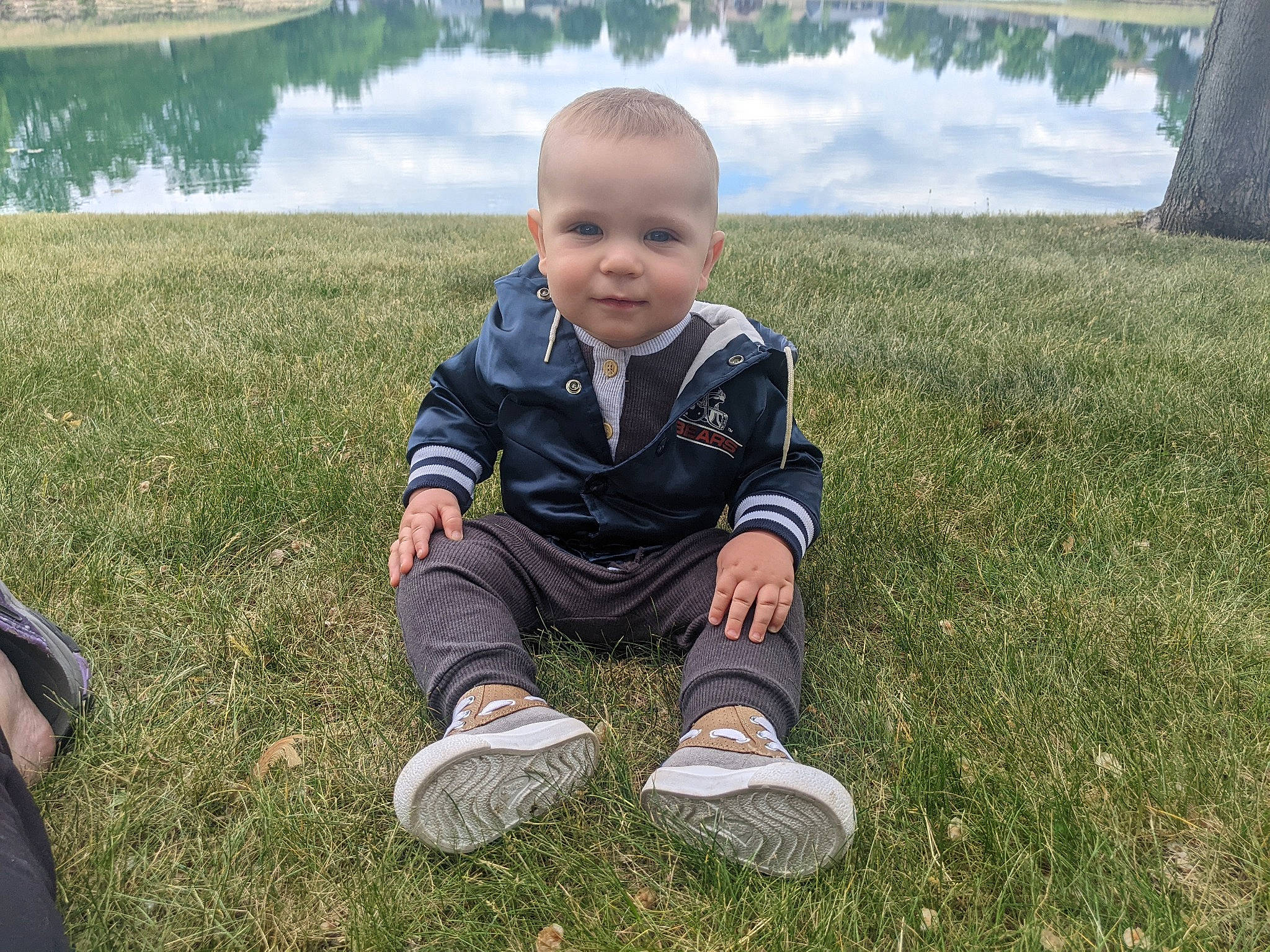 Brody joined the competition — help win amazing prizes! baby, baby_toddler_clothing, child, fun, grass, grass_family, grassland, happy, lake, lawn, leisure, people_in_nature, person, plant, recreation, sitting, soil, toddler, tree, vacation