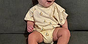 Jack joined the competition — help win amazing prizes! baby, child, couch, smiling, onesie, sitting, indoor, furniture, happy, infant, person, clothing, foot, hand, face, home, cute, young, relaxed, background