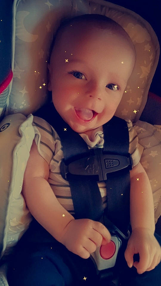 Lyric is registered to the contest to win money with this photo: arm, baby, baby_toddler_clothing, cheek, finger, flash_photography, fun, gesture, hand, happy, iris, lip, mouth, nose, person, pink, product, skin, smile, thumb