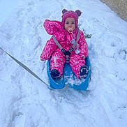 Léïa a rejoint le concours — aidez-le/la à gagner de superbes lots ! child, toddler, snow, sled, winter_clothing, pink_snowsuit, hat, pacifier, outdoor, snowy_path, cold_weather, boots, play, winter, snow_fun, baby, cute, winter_accessories, fun, person