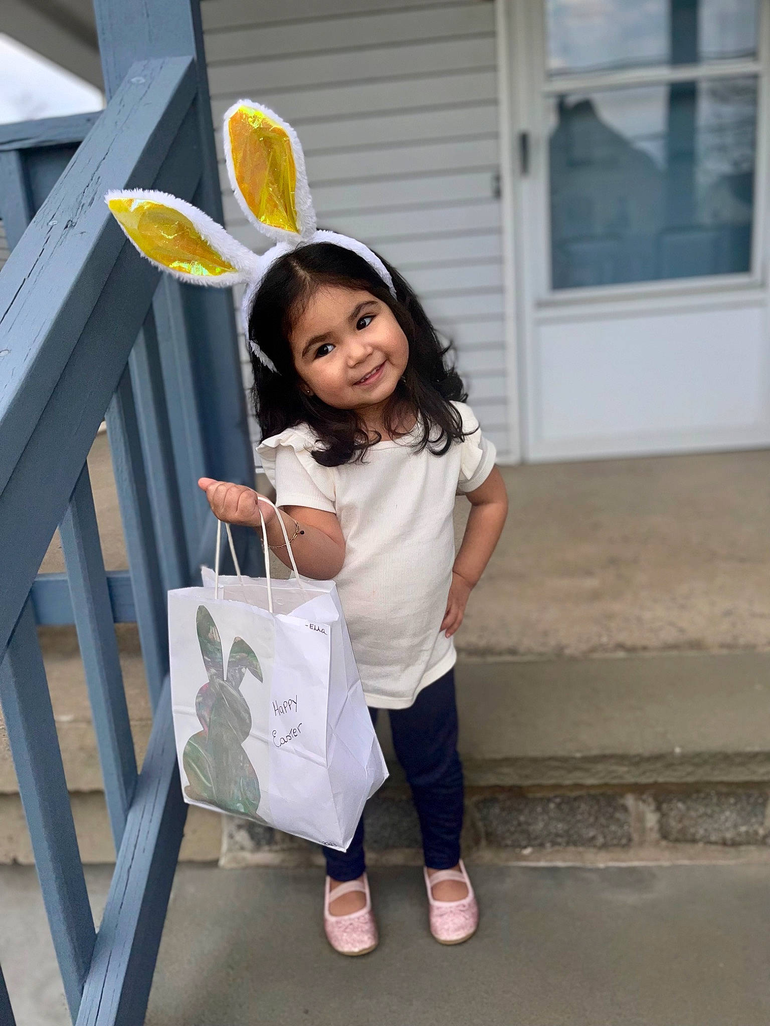 Ella is registered to the contest to win money with this photo: automotive_wheel_system, bag, child, denim, eyewear, fashion_accessory, fun, happy, human_leg, joy, leisure, luggage_and_bags, pattern, person, sandal, shoe, sitting, smile, t_shirt, toddler