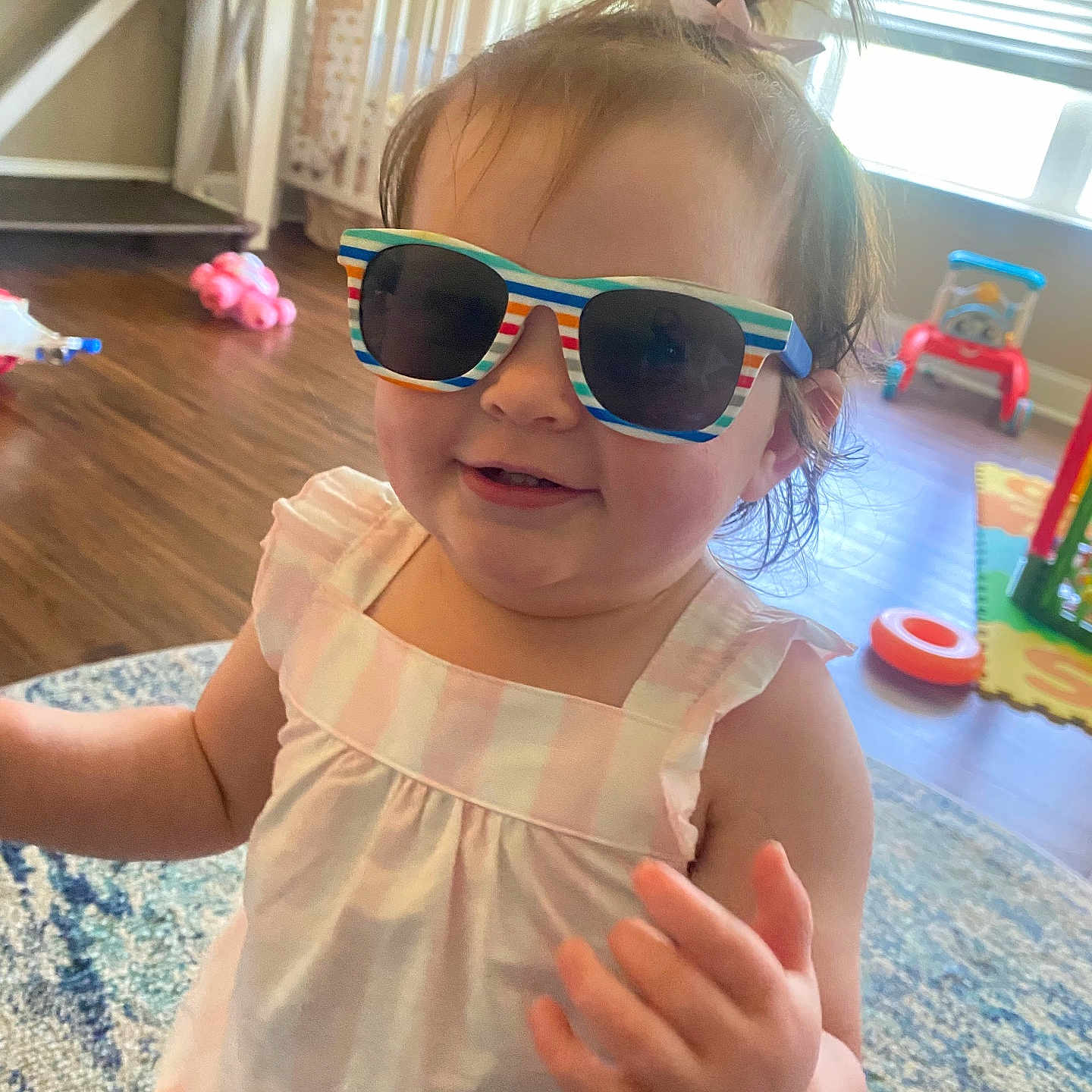 Christine joined the competition — help win amazing prizes! baby, carpet, child, cute, dress, floor, furniture, hair, hand, happy, home, indoor, light, person, play, smile, sunglasses, toddler, toy, window