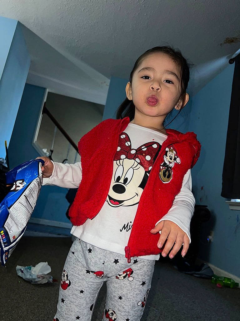 Liliana is registered to the contest to win money with this photo: baby_toddler_clothing, carmine, child, fashion_design, flooring, fun, happy, knee, pajamas, pattern, person, personal_protective_equipment, sitting, sleeve, sportswear, t_shirt, thigh, toddler, trunk, uniform