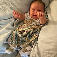 Rosie-Araya joined the competition — help win amazing prizes! baby, bed, blanket, child, comfort, cozy, cushion, cute, face, hands, happy, indoors, infant, lying, pajamas, person, sleepwear, smiling, soft, toddler