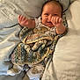 baby, bed, blanket, child, comfort, cozy, cushion, cute, face, hands, happy, indoors, infant, lying, pajamas, person, sleepwear, smiling, soft, toddler