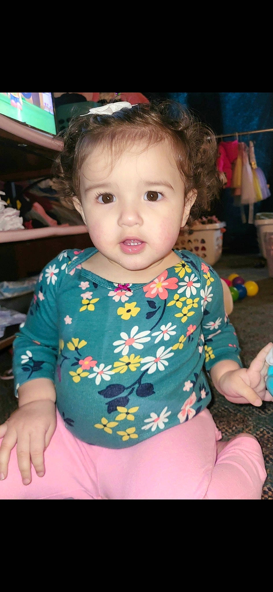 Kamya is registered to the contest to win money with this photo: baby, baby_toddler_clothing, beauty, cheek, child, event, facial_expression, fun, hairstyle, happy, iris, leisure, pattern, person, sitting, skin, sleeve, t_shirt, television, thigh