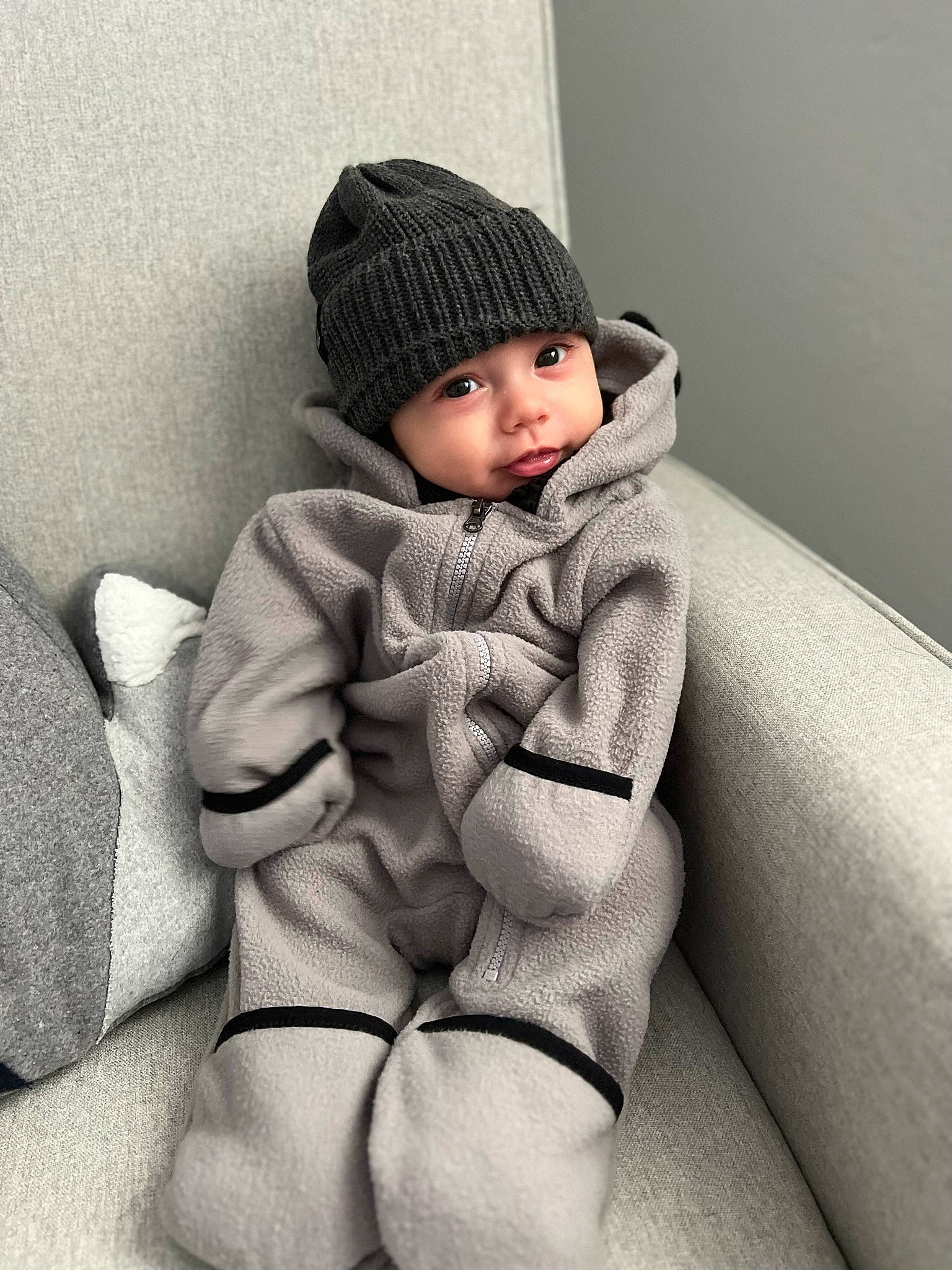 Caden joined the competition — help win amazing prizes! baby, baby_toddler_clothing, beanie, cap, child, comfort, elbow, fashion_accessory, fur, head, headwear, human_leg, knee, knit_cap, leg, monochrome_photography, pattern, person, sitting, sleeve