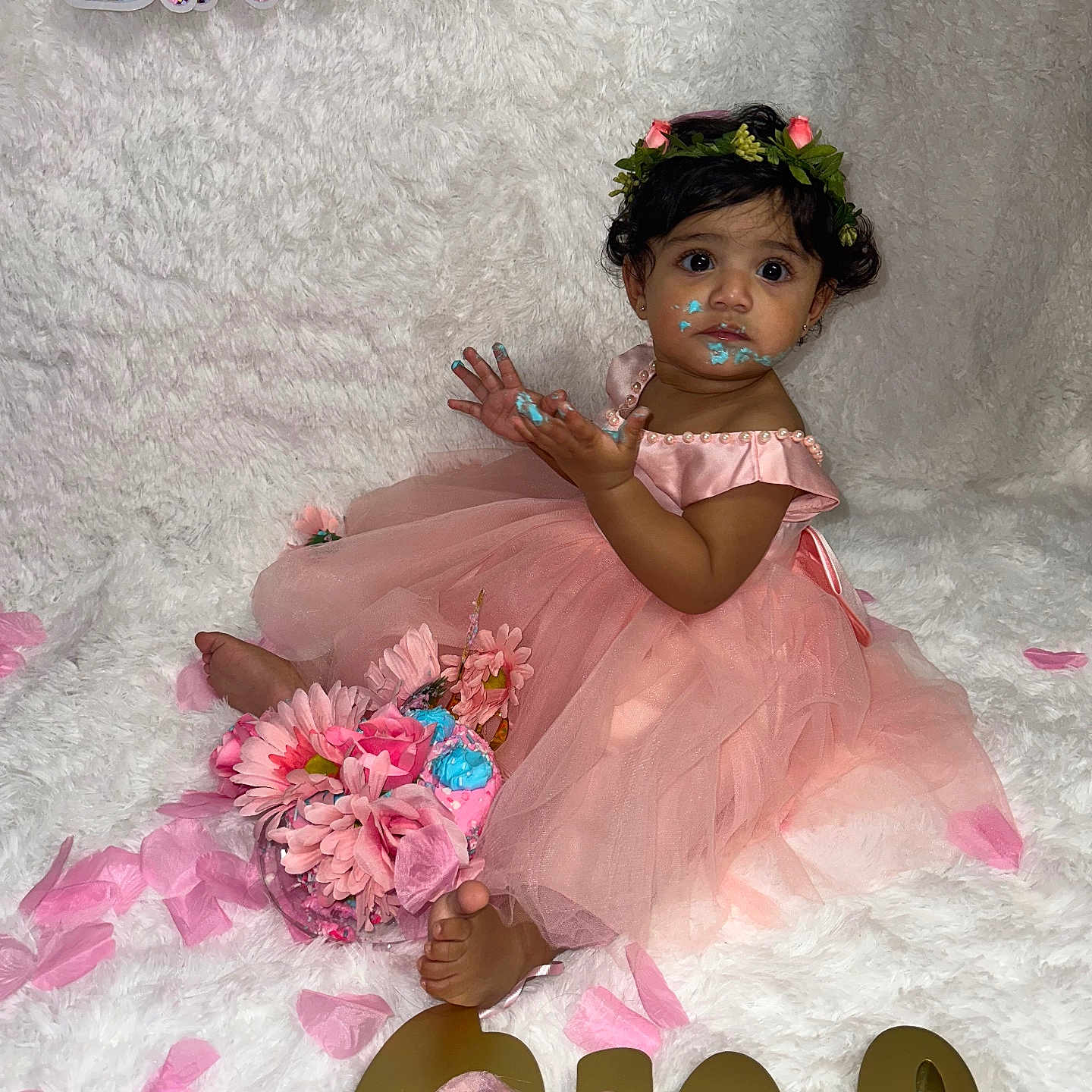 Sara Rodriguez joined the competition — help win amazing prizes! baby, birthday, cake, celebration, child, cute, decorations, dress, floral, flower_crown, foot, girl, petals, pink, portrait, sitting, smile, smudge, toddler, white_background