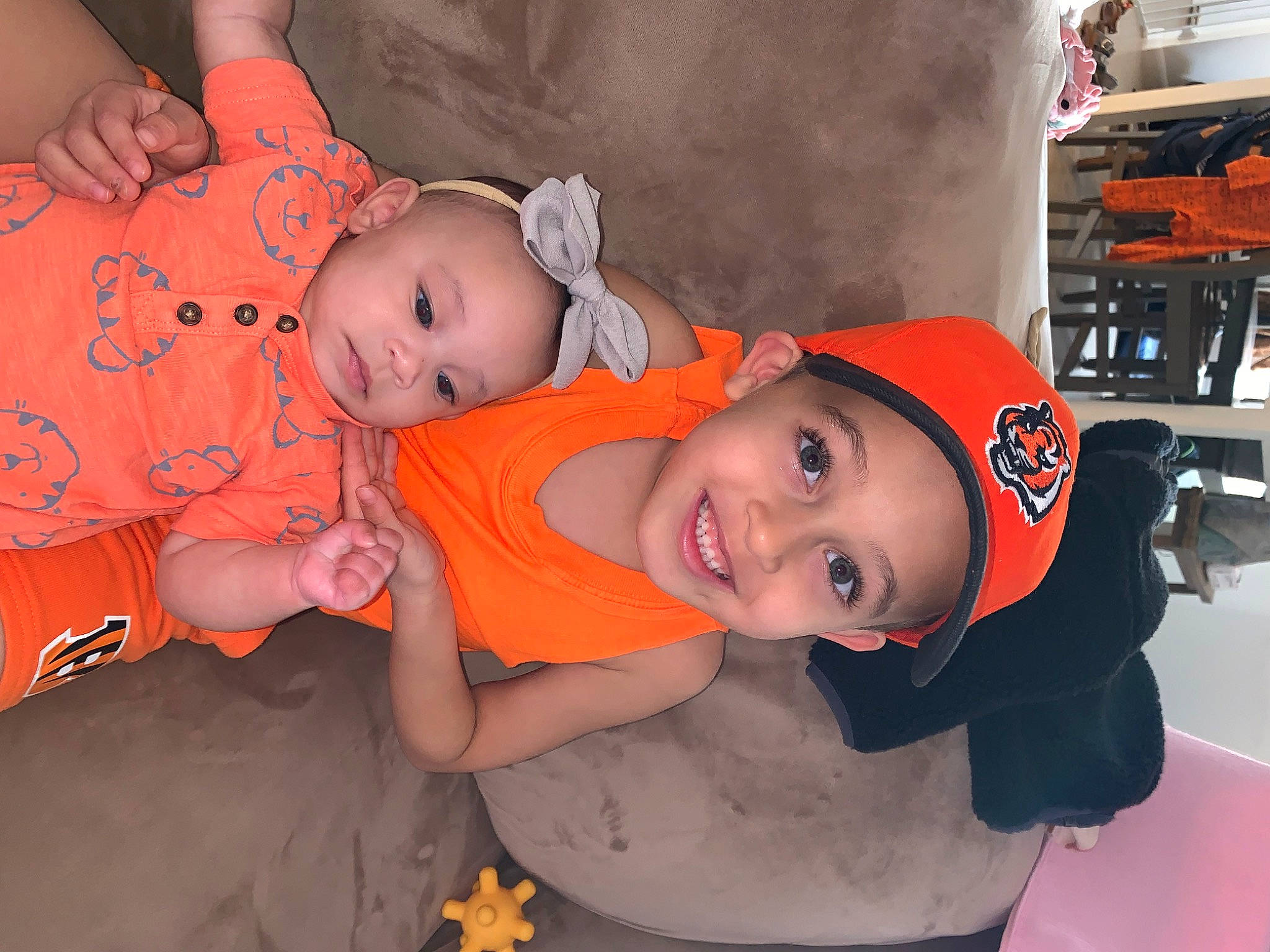 Elijah joined the competition — help win amazing prizes! baby, baby_products, baby_toddler_clothing, baseball_cap, cap, cheek, child, event, fun, happy, hat, headwear, joy, mouth, orange, party, person, room, sitting, skin