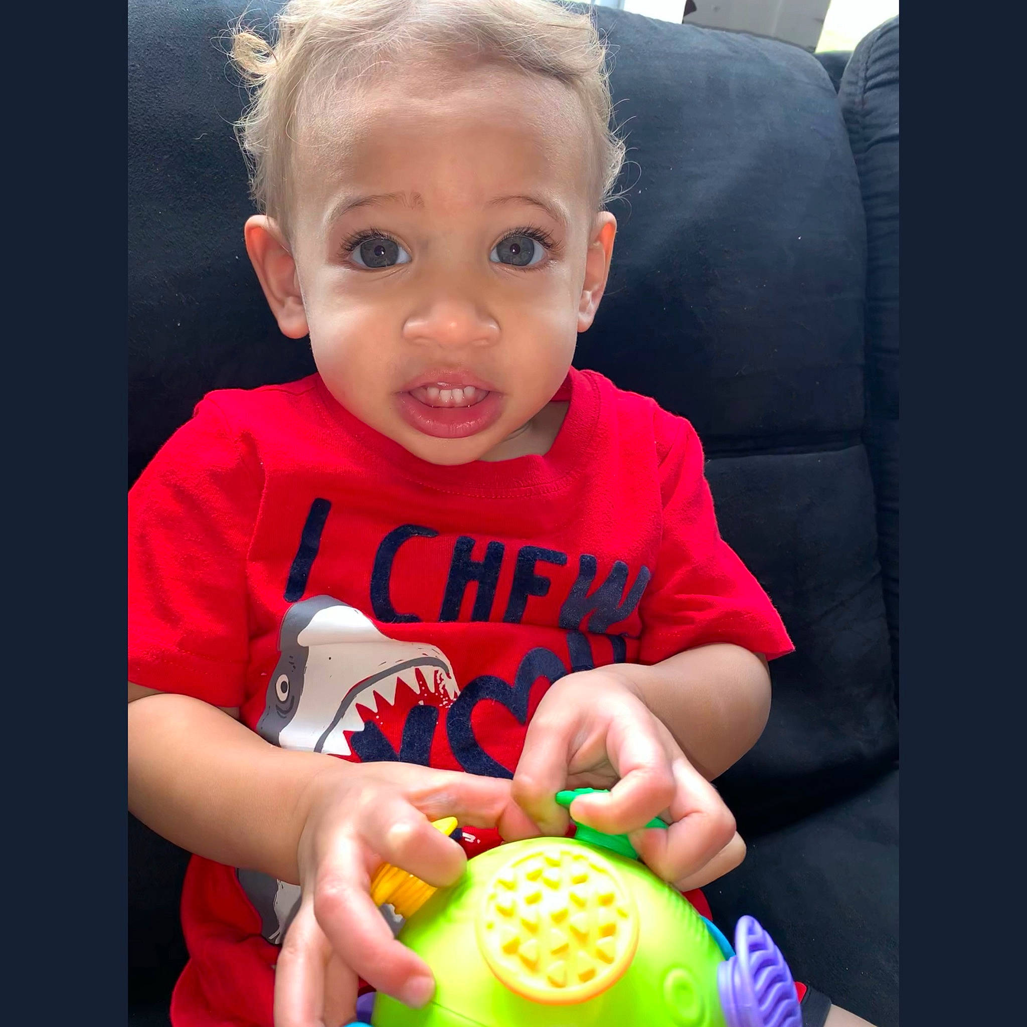 Isaiah joined the competition — help win amazing prizes! baby, baby_playing_with_toys, baby_products, baby_toddler_clothing, cheek, child, couch, fun, green, happy, junk_food, nail, person, play, sitting, sleeve, smile, sweetness, t_shirt, toddler