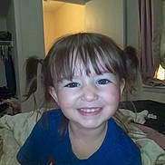 Aurora Cherry Cola joined the competition — help win amazing prizes! child, girl, smile, pigtails, blue_shirt, indoor, bedroom, curtains, bed, blanket, doorway, clothing, happy, face, person, portrait, young_child, room, hair, casual
