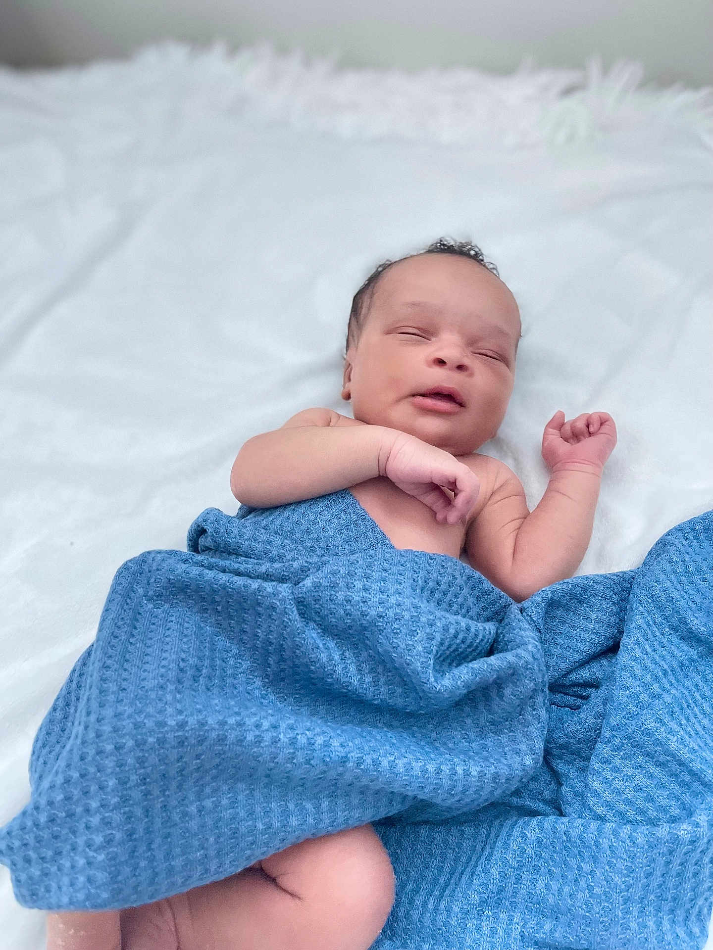 Chibugom is registered to the contest to win money with this photo: baby, newborn, blanket, blue, sleeping, infant, soft, white_background, peaceful, resting, wrapped, cute, skin, hand, face, lying_down, cozy, toddler, indoors, portrait