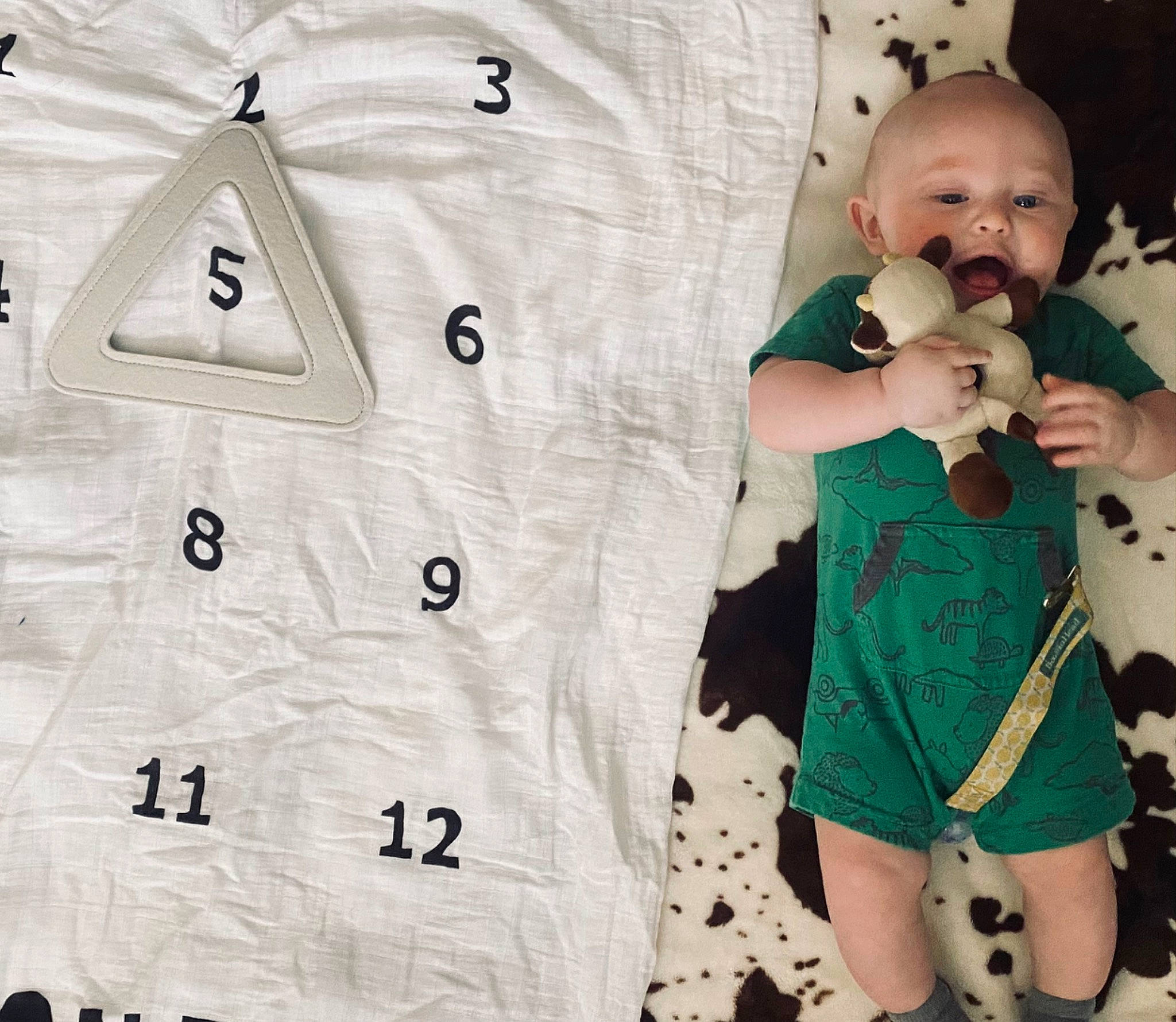Henlee is registered to the contest to win money with this photo: arm, baby, baby_toddler_clothing, collar, fashion, font, hand, happy, human_body, infant_bodysuit, outerwear, pattern, person, photograph, product, sleeve, snapshot, t_shirt, textile, toddler