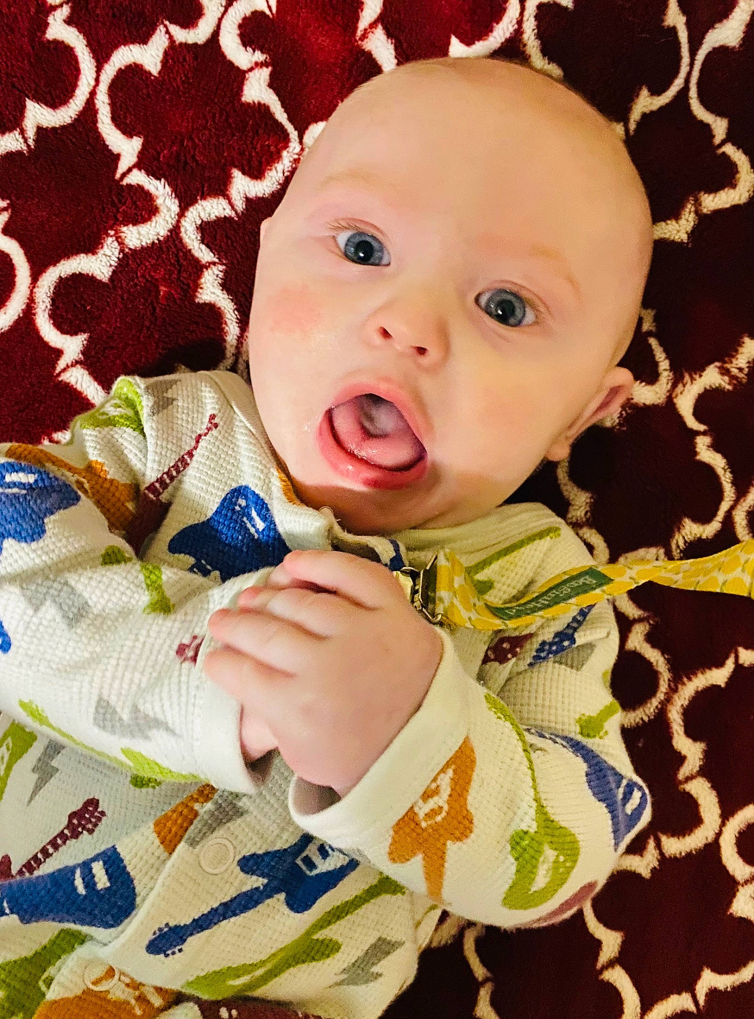 Henlee is registered to the contest to win money with this photo: baby, baby_products, baby_safety, baby_toddler_clothing, cheek, child, comfort, happy, iris, linens, pattern, person, product, sitting, skin, sleeve, surprise, textile, toddler