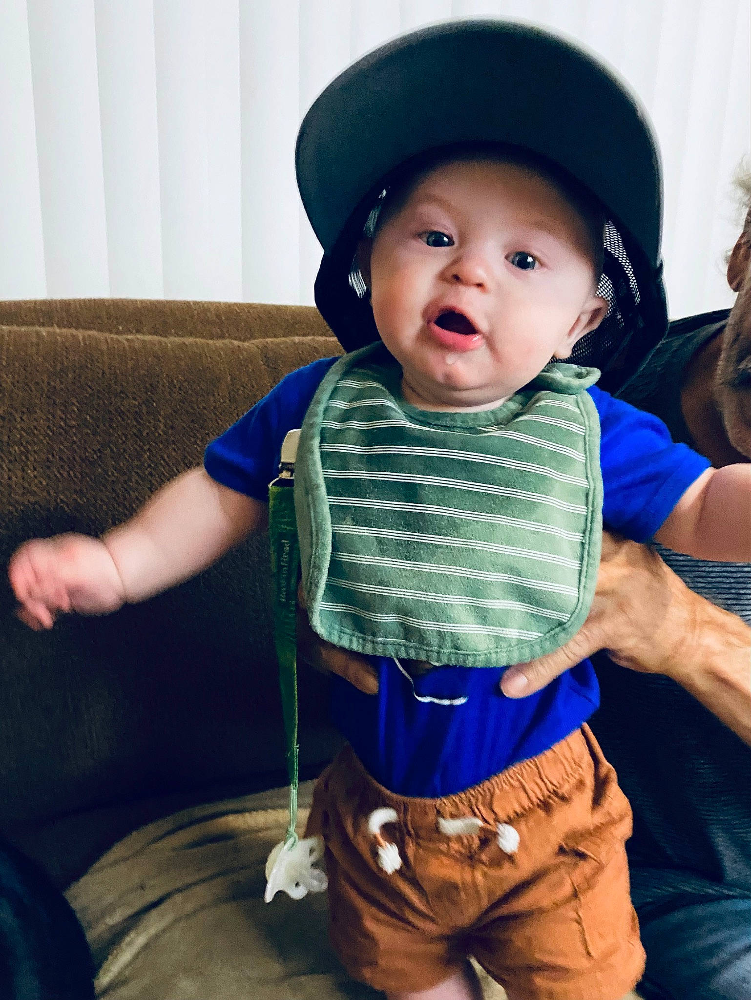 Henlee is registered to the contest to win money with this photo: baby, baby_toddler_clothing, cap, child, cool, electric_blue, fun, gesture, happy, hat, headwear, helmet, person, personal_protective_equipment, shoulder, skin, sleeve, smile, standing, toddler