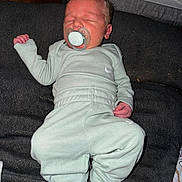 Damian joined the competition — help win amazing prizes! newborn, baby, sleeping, pacifier, clothing, mint_green, socks, blanket, infant, resting, indoors, cute, face, head, person, child, soft, peaceful, tiny, cozy