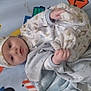 Zayden joined the competition — help win amazing prizes! animal_print, baby, blanket, child, comfort, cozy, cute, floor_mat, hat, indoors, infant, lying_down, pajamas, person, plush_toy, road_sign, sleepwear, soft_toy, star_pattern, teddy_bear