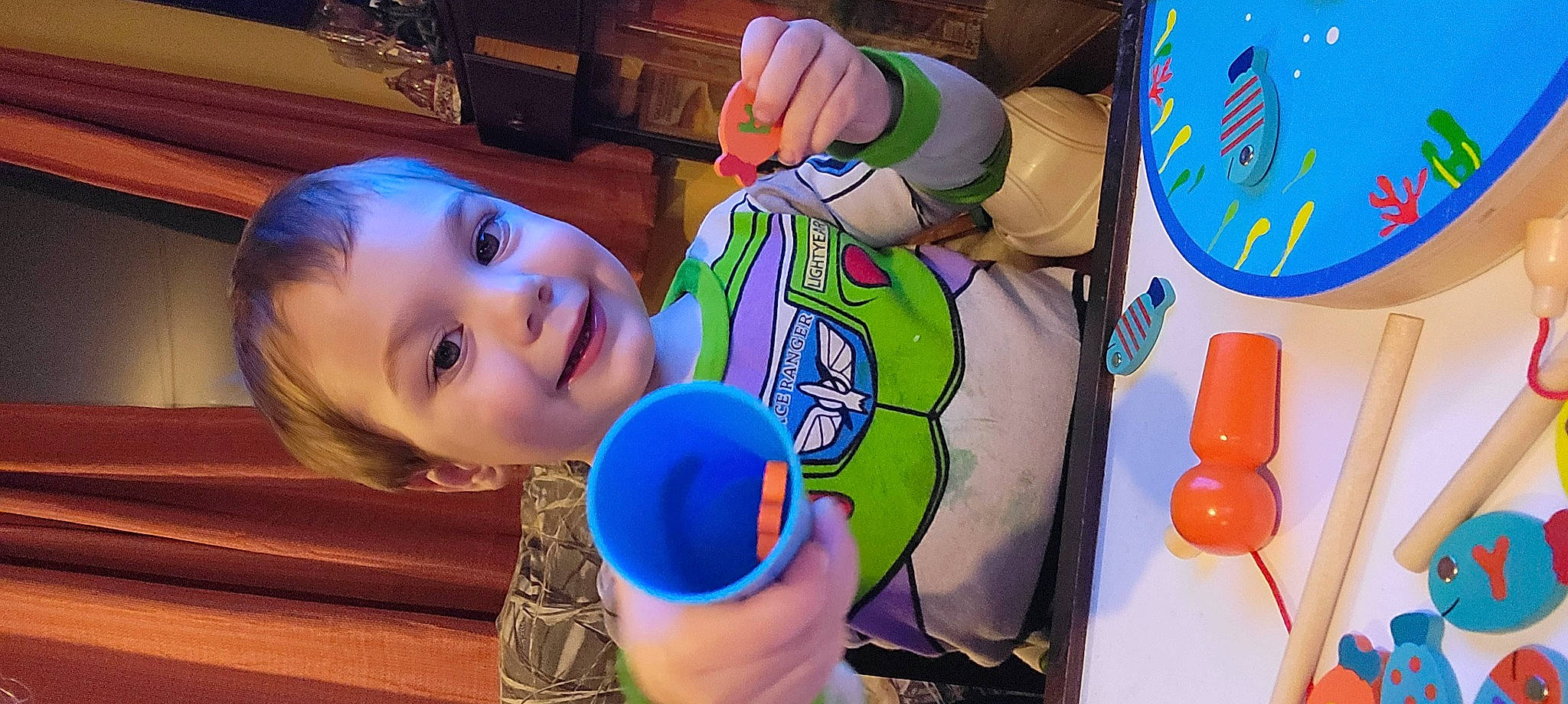 Emmet is registered to the contest to win money with this photo: art, baby_toddler_clothing, baby_toys, child, circle, electric_blue, fun, happy, joy, leisure, musical_instrument, paint, party_supply, person, plastic, play, recreation, smile, toddler, toy