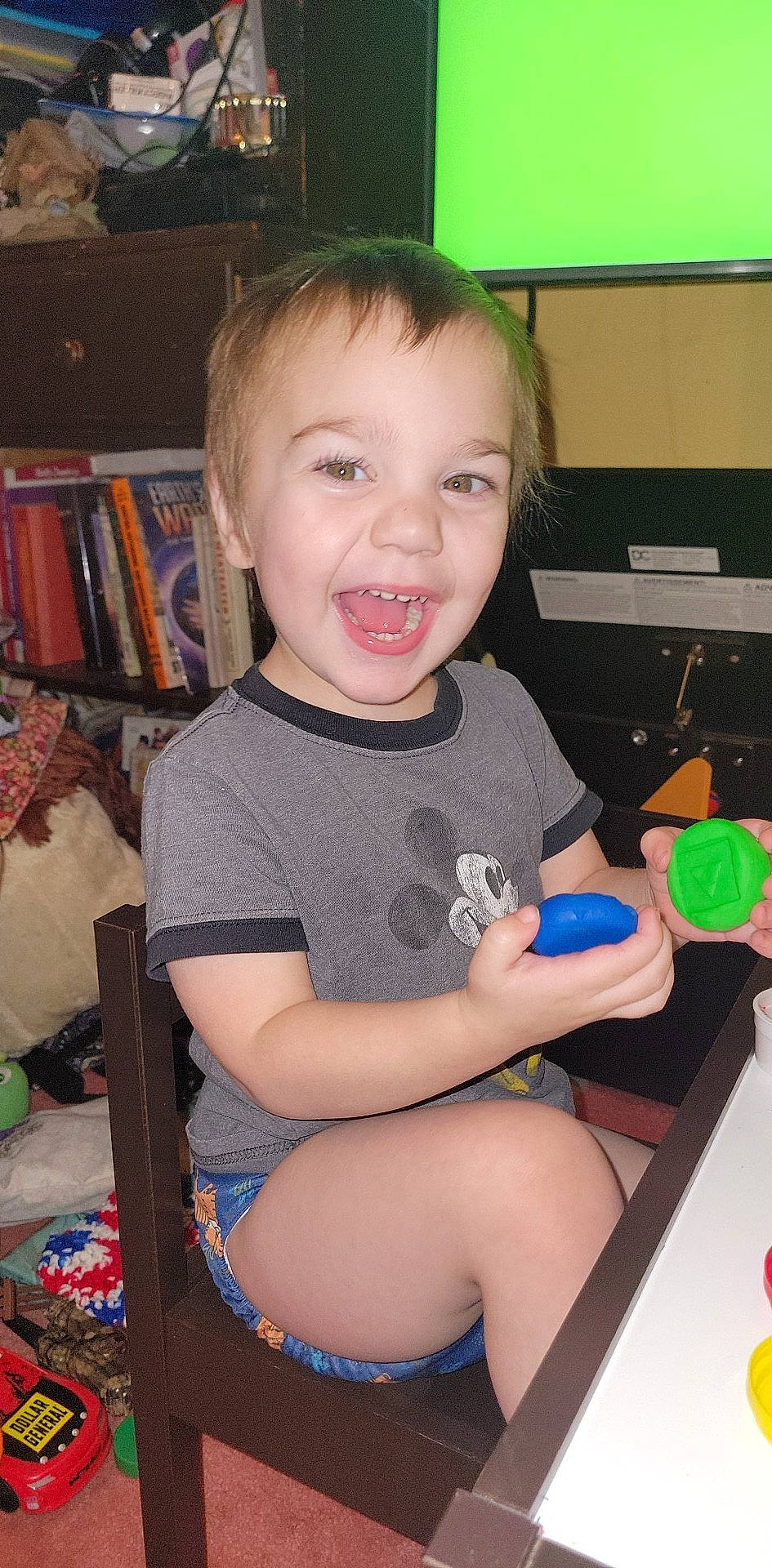 Emmet joined the competition — help win amazing prizes! baby_toddler_clothing, bookcase, cheek, child, event, fun, happy, human_body, human_leg, knee, lap, person, play, room, shelf, sitting, smile, standing, t_shirt, thigh