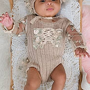 Eva joined the competition — help win amazing prizes! baby, infant, wicker_bassinet, lace, knit_clothing, floral_embroidery, beige, soft_texture, pastel, cute, child, portrait, indoors, sleeping_area, hand, foot, expression, cozy, lying_down, headwear