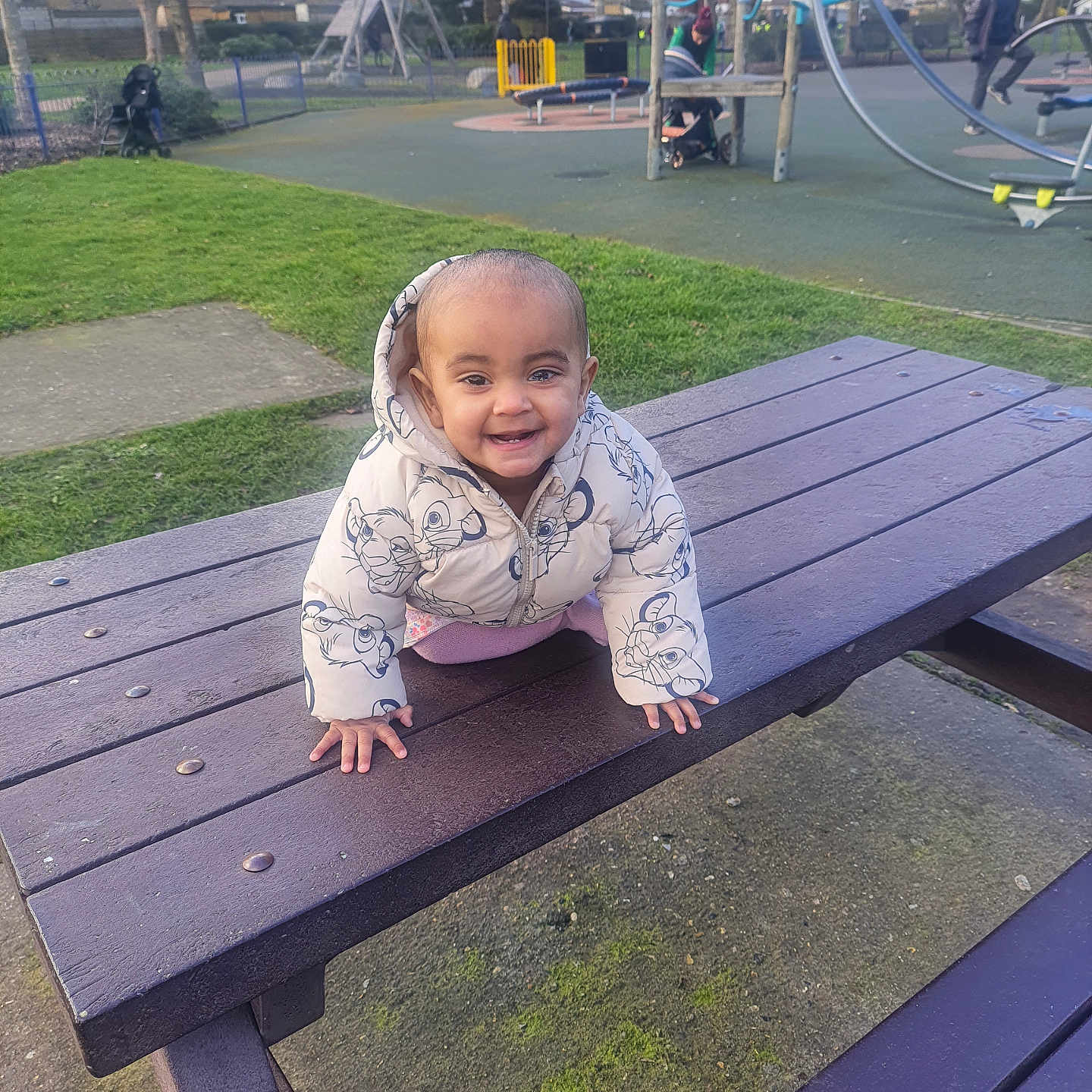 Leora Ragati is registered to the contest to win money with this photo: baby, bench, clothing, crawling, face, footwear, grass, hat, head, nature, outdoorplayarea, outdoors, park, person, photography, plant, playarea, portrait, shoe, wood