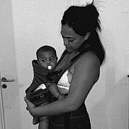 Alioune Tikilagi participe au concours pour gagner de l'argent avec cette photo : affection, baby, baby_carrier, black_and_white, casual_clothing, child, door, family, floor, hair, holding, indoor, love, monochrome, pacifier, parent, person, portrait, tenderness, woman