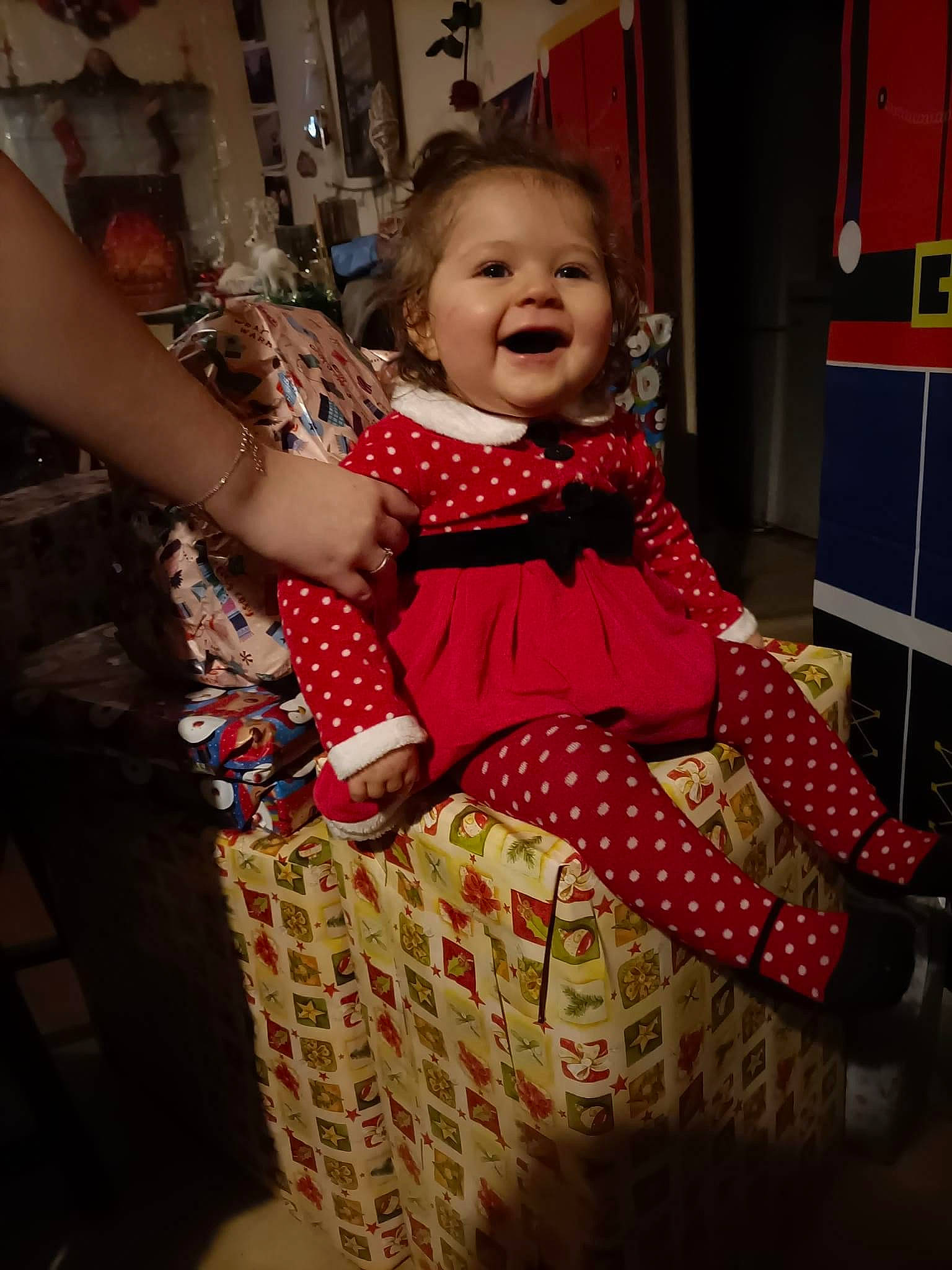 Kelly participe au concours pour gagner de l'argent avec cette photo : baby, baby_toddler_clothing, child, dress, event, fashion_design, flooring, formal_wear, fun, happy, holiday, magenta, one_piece_garment, pattern, person, room, sitting, sleeve, smile, textile