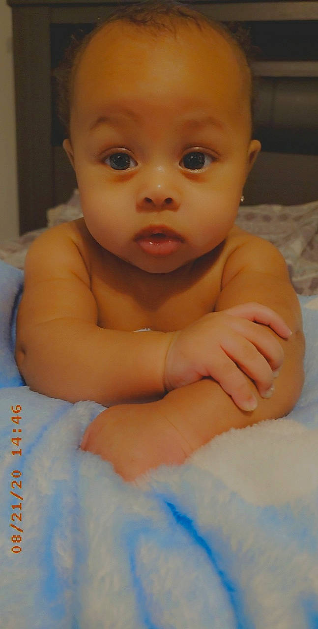 Trenton is registered to the contest to win money with this photo: baby, cheek, child, chin, eye, eyebrow, face, forehead, head, iris, lip, mouth, muscle, nose, person, skin, smile, surprise, toddler